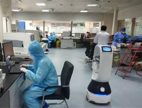 A Keenon robot navigates through a hospital
